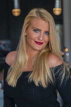 A gorgeous blonde model enjoys a day at home before work
