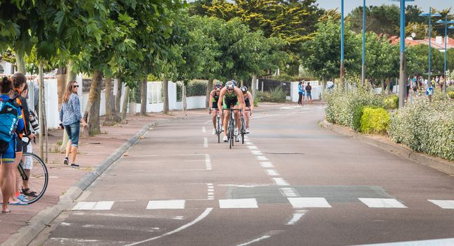 Saint Gilles Croix de Vie, France - September 10, 2016: frontrunners in a bend on the final Triathlon Championship of France in the category D3