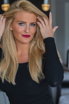 A gorgeous blonde model enjoys a day at home before work