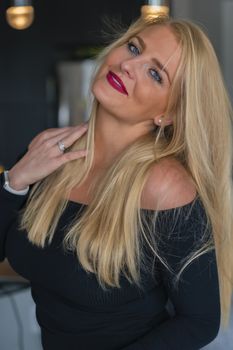 A gorgeous blonde model enjoys a day at home before work