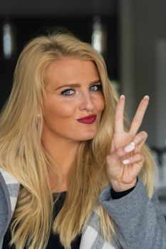 A gorgeous blonde model enjoys a day at home before work