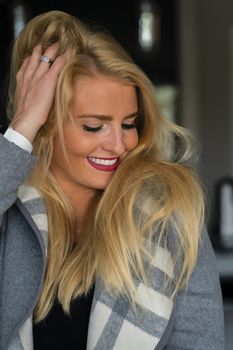 A gorgeous blonde model enjoys a day at home before work
