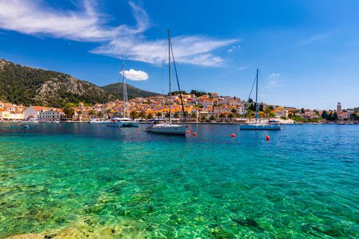 View at amazing archipelago with fishing boats in town Hvar, Croatia. Harbor of old Adriatic island town Hvar. Popular touristic destination of Croatia. Amazing Hvar city on Hvar island, Croatia.
