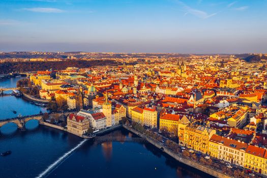 Aerial Prague panoramic drone view of the city of Prague at the Old Town Square, Czechia. Prague Old Town pier architecture and Charles Bridge over Vltava river in Prague at sunset, Czech Republic. 