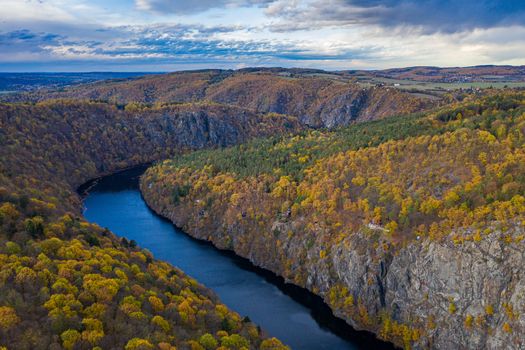 Beautiful Vyhlidka Maj, Lookout Maj, near Teletin, Czech Republic. Meander of the river Vltava surrounded by colorful autumn forest viewed from above. Tourist attraction in Czech landscape. Czechia.