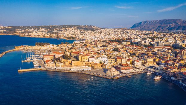 Picturesque old port of Chania. Landmarks of Crete island. Greece. Aerial view of the beautiful city of Chania with it's old harbor and the famous lighthouse, Crete, Greece.