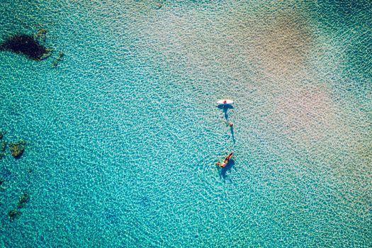 Aerial drone shot of beautiful turquoise beach with pink sand Elafonissi, Crete, Greece. Best beaches of Mediterranean, Elafonissi beach, Crete, Greece. Famous Elafonisi beach on Greece island, Crete.