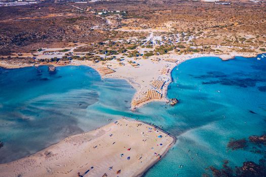 Aerial view of beautiful tropical Elafonissi Beach with pink sand. View of a nice tropical Elafonissi beach from the air. Beautiful sky, sea, resort. Elafonissi beach, Crete, Greece.