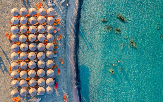 Aerial view of beautiful tropical Elafonissi Beach with pink sand. View of a nice tropical Elafonissi beach from the air. Beautiful sky, sea, resort. Elafonissi beach, Crete, Greece.
