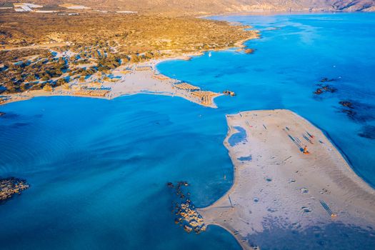 Aerial view of beautiful tropical Elafonissi Beach with pink sand. View of a nice tropical Elafonissi beach from the air. Beautiful sky, sea, resort. Elafonissi beach, Crete, Greece.