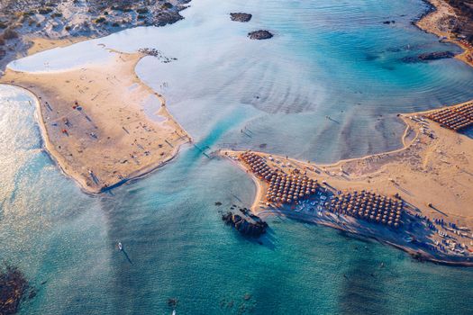 Aerial view of beautiful tropical Elafonissi Beach with pink sand. View of a nice tropical Elafonissi beach from the air. Beautiful sky, sea, resort. Elafonissi beach, Crete, Greece.