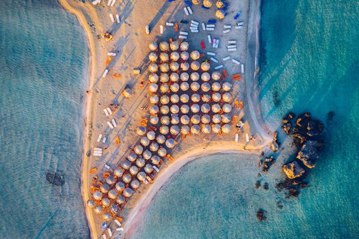 Aerial view of beautiful tropical Elafonissi Beach with pink sand. View of a nice tropical Elafonissi beach from the air. Beautiful sky, sea, resort. Elafonissi beach, Crete, Greece.