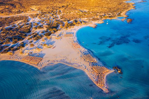 Aerial view of beautiful tropical Elafonissi Beach with pink sand. View of a nice tropical Elafonissi beach from the air. Beautiful sky, sea, resort. Elafonissi beach, Crete, Greece.