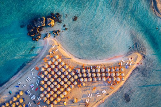 Aerial drone shot of beautiful turquoise beach with pink sand Elafonissi, Crete, Greece. Best beaches of Mediterranean, Elafonissi beach, Crete, Greece. Famous Elafonisi beach on Greece island, Crete.