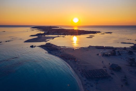 Aerial view of beautiful tropical Elafonissi Beach with pink sand. View of a nice tropical Elafonissi beach from the air. Beautiful sky, sea, resort. Elafonissi beach, Crete, Greece.