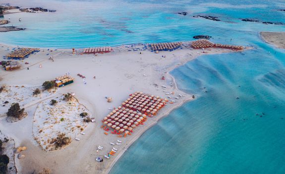 Aerial view of beautiful tropical Elafonissi Beach with pink sand. View of a nice tropical Elafonissi beach from the air. Beautiful sky, sea, resort. Elafonissi beach, Crete, Greece.