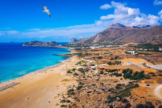 Aerial shot of beautiful turquoise beach Falasarna (Falassarna) in Crete, Greece. View of famous paradise sandy deep turquoise beach of Falasarna (Falassarna) in North West, Crete island, Greece.