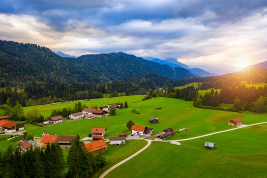 View from flying drone. Astonishing evening view of Wagenbruchsee (Geroldsee) lake with Westliche Karwendelspitze mountain range on background, Bavarian Alps, Germany, Europe.