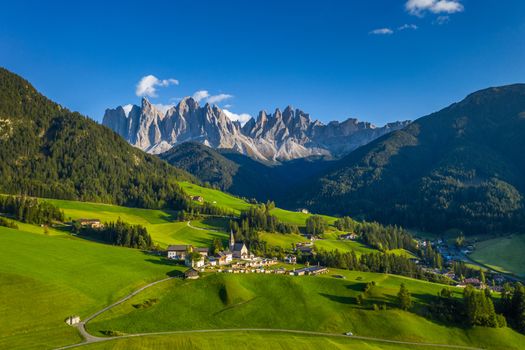 Santa Maddalena (Santa Magdalena) village with magical Dolomites mountains in background, Val di Funes valley, Trentino Alto Adige region, South Tyrol, Italy, Europe. Santa Maddalena Village, Italy. 