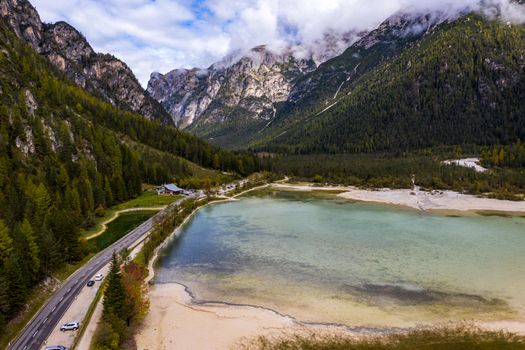 Lago di Landro, lake in the Dolomites in South Tyrol, Italy. Autumn peaceful alpine lake Durrensee or Lago di Landro. Mountains above the lake Lago di Landro. In the fall, Dolomites, Italy.
