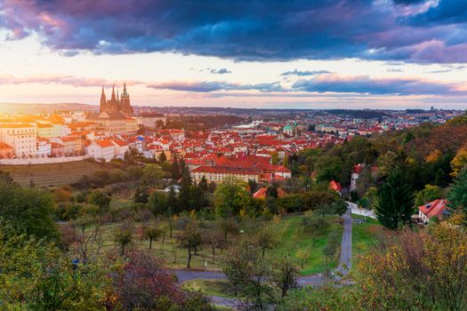 Prague autumn landscape. Prague autumn landscape view to Saint Vitus cathedral. Prague. Prague panorama. Prague, Czech Republic. Scenic autumn aerial view of the Old Town with red foliage. Czechia.