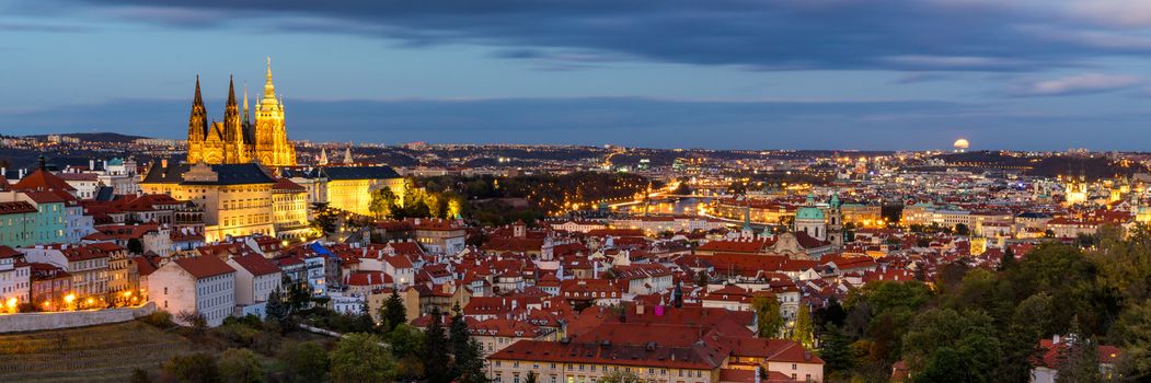 Prague autumn landscape. Prague autumn landscape view to Saint Vitus cathedral. Prague. Prague panorama. Prague, Czech Republic. Scenic autumn aerial view of the Old Town with red foliage. Czechia.