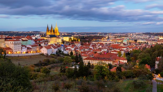 Prague autumn landscape. Prague autumn landscape view to Saint Vitus cathedral. Prague. Prague panorama. Prague, Czech Republic. Scenic autumn aerial view of the Old Town with red foliage. Czechia.