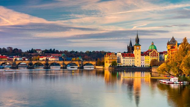 Charles Bridge in Prague in Czechia. Prague, Czech Republic. Charles Bridge (Karluv Most) and Old Town Tower. Vltava River and Charles Bridge. Concept of world travel, sightseeing and tourism.