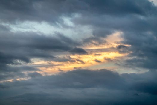 Hilo, Hawaii, USA. - January 14, 2020: Spectacular levening cloudscape with fire by sunlight in the dark blueish sky