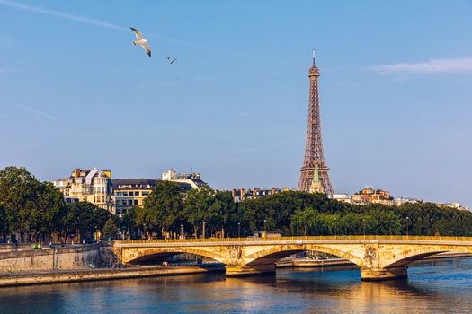 Paris Eiffel Tower and river Seine at sunset in Paris, France. Eiffel Tower is one of the most iconic landmarks of Paris. Eiffel tower in summer, Paris, France. The Eiffel Tower in Paris, France.