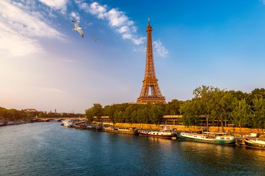 Paris Eiffel Tower and river Seine at sunset in Paris, France. Eiffel Tower is one of the most iconic landmarks of Paris. Eiffel tower in summer, Paris, France. The Eiffel Tower in Paris, France.
