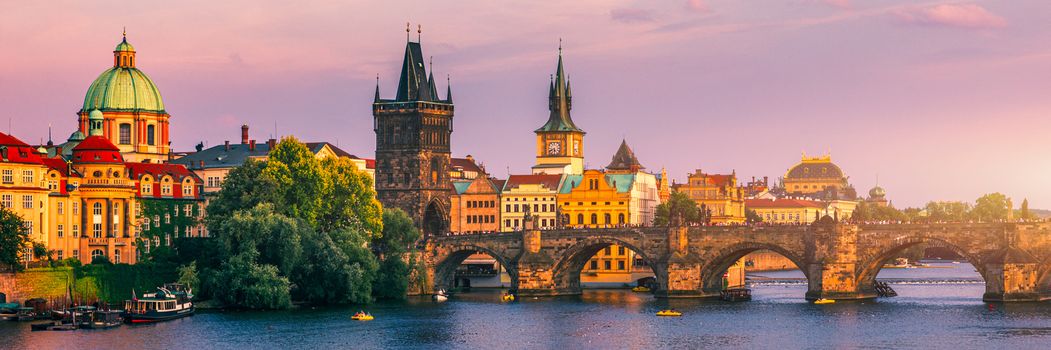 Charles Bridge in Prague in Czechia. Prague, Czech Republic. Charles Bridge (Karluv Most) and Old Town Tower. Vltava River and Charles Bridge. Concept of world travel, sightseeing and tourism.