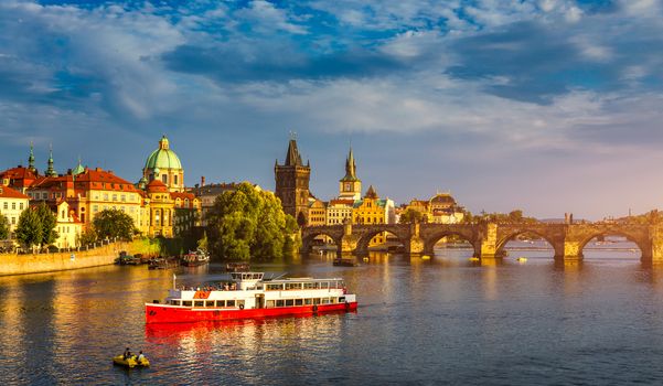 Charles Bridge in Prague in Czechia. Prague, Czech Republic. Charles Bridge (Karluv Most) and Old Town Tower. Vltava River and Charles Bridge. Concept of world travel, sightseeing and tourism.