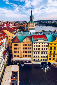 Scenic summer aerial panorama of the Old Town architecture in Prague, Czech Republic. Red roof tiles panorama of Prague old town.  Prague Old Town Square houses with traditional red roofs. Czechia.