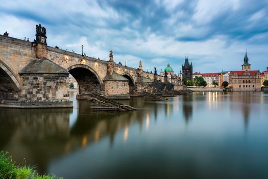 Charles Bridge in Prague in Czechia. Prague, Czech Republic. Charles Bridge (Karluv Most) and Old Town Tower. Vltava River and Charles Bridge. Concept of world travel, sightseeing and tourism.