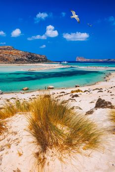 Balos Lagoon and Gramvousa island on Crete with seagulls flying over, Greece. Cap tigani in the center. Balos beach on Crete island, Greece. Crystal clear water of Balos beach.