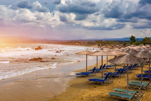 View of sunbeds awaiting tourists at the Greek island resort of Georgioupolis on Crete north coast. Georgioupoli is a resort village and former municipality in the Chania regional unit, Crete, Greece.