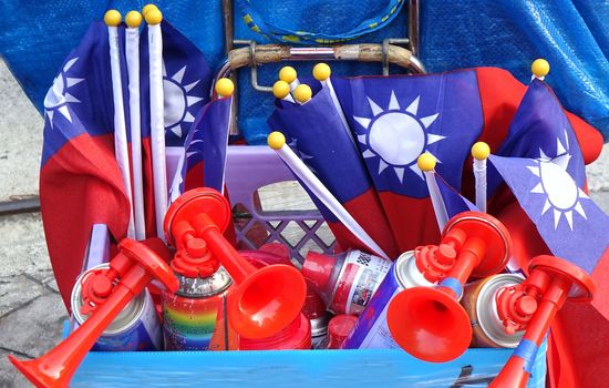 KAOHSIUNG, TAIWAN -- NOVEMBER 10, 2018: A vendor sells air horns and national flags at an election rally.
