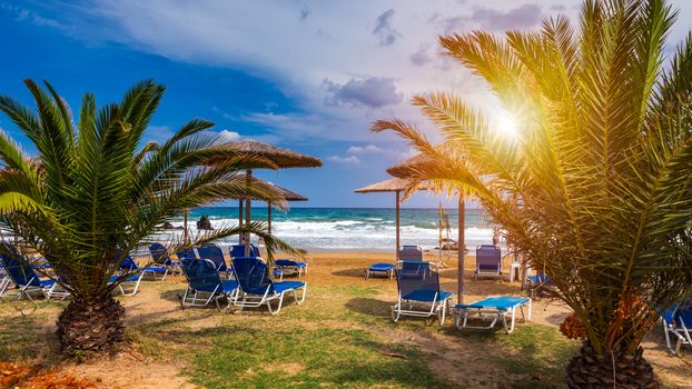 View of sunbeds awaiting tourists at the Greek island resort of Georgioupolis on Crete north coast. Georgioupoli is a resort village and former municipality in the Chania regional unit, Crete, Greece.
