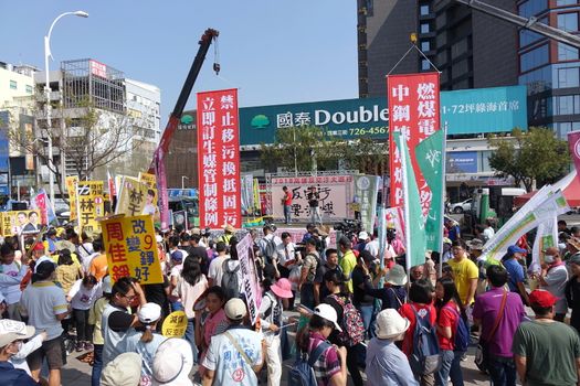 KAOHSIUNG, TAIWAN -- NOVEMBER 11, 2018: A speaker addresses protesters who have gathered to take part in a demonstration against the problem of serious air pollution.
