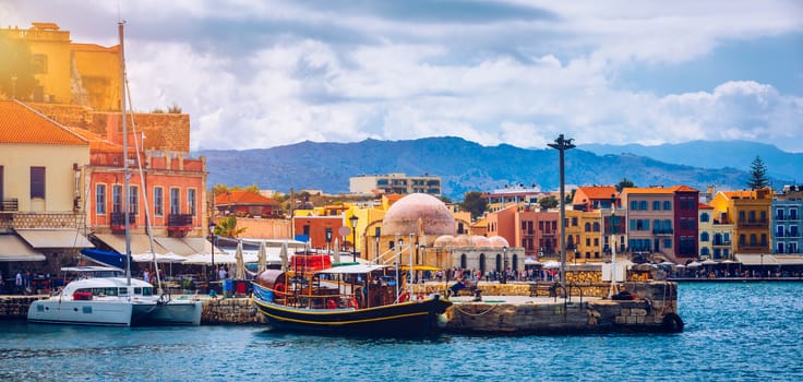 Picturesque old port of Chania. Landmarks of Crete island. Greece. Bay of Chania at sunny summer day, Crete Greece. View of the old port of Chania, Crete, Greece. The port of chania, or Hania. 