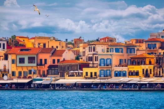 Old port of Chania with flying seagulls. Landmarks of Crete island. Bay of Chania at sunny summer day, Crete Greece. View of the old port of Chania, Crete, Greece. The port of chania, or Hania. 