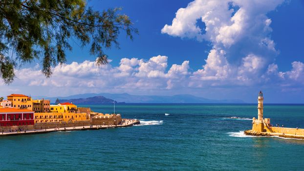 Panorama of venetian harbour waterfront and lighthouse in old harbour of Chania, Crete, Greece. Old venetian lighthouse in Chania, Greece. Lighthouse of the old Venetian port in Chania, Greece.
