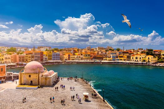 Mosque in the old Venetian harbor of Chania town on Crete island, Greece. Old mosque in Chania. Janissaries or Kioutsouk Hassan Mosque in Chania Crete. Turkish mosque in Chania bay. Crete, Greece.