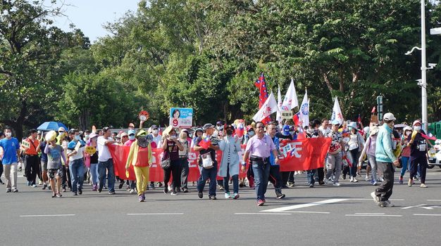 KAOHSIUNG, TAIWAN -- NOVEMBER 11, 2018: Demonstrators take part in a  protest march against the problem of serious air pollution.
