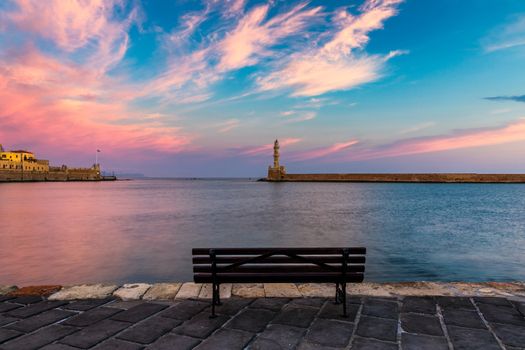 Venetian harbour and lighthouse in old harbour of Chania at sunrise, Crete, Greece. Old venetian lighthouse in Chania, Greece. Lighthouse of the old Venetian port in Chania, Greece.