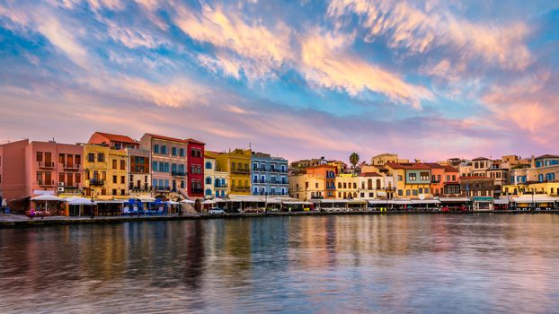 Venetian Harbour of the city of Chania at sunrise with turquoise water, Crete, Greece. View of the old port of Chania on Crete, Greece. Chania, Crete, Greece. View of the old port of Chania on Crete.