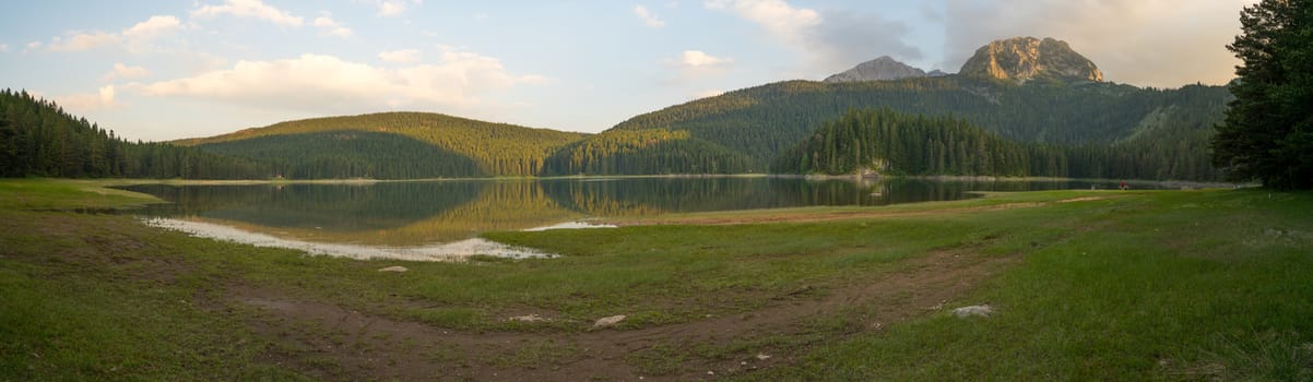 ZABLJAK, MONTENEGRO - JULY 02, 2015: Panoramic view of the Black Lake (Crno jezero), with visitors, in Durmitor National Park, Montenegro