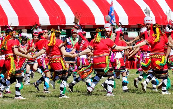 KAOHSIUNG, TAIWAN -- SEPTEMBER 29, 2018: Members of the indigenous Amis tribe in traditional costumes participate in the yearly harvest festival.