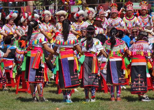 KAOHSIUNG, TAIWAN -- SEPTEMBER 29, 2018: Members of the indigenous Amis tribe in traditional costumes participate in the yearly harvest festival.